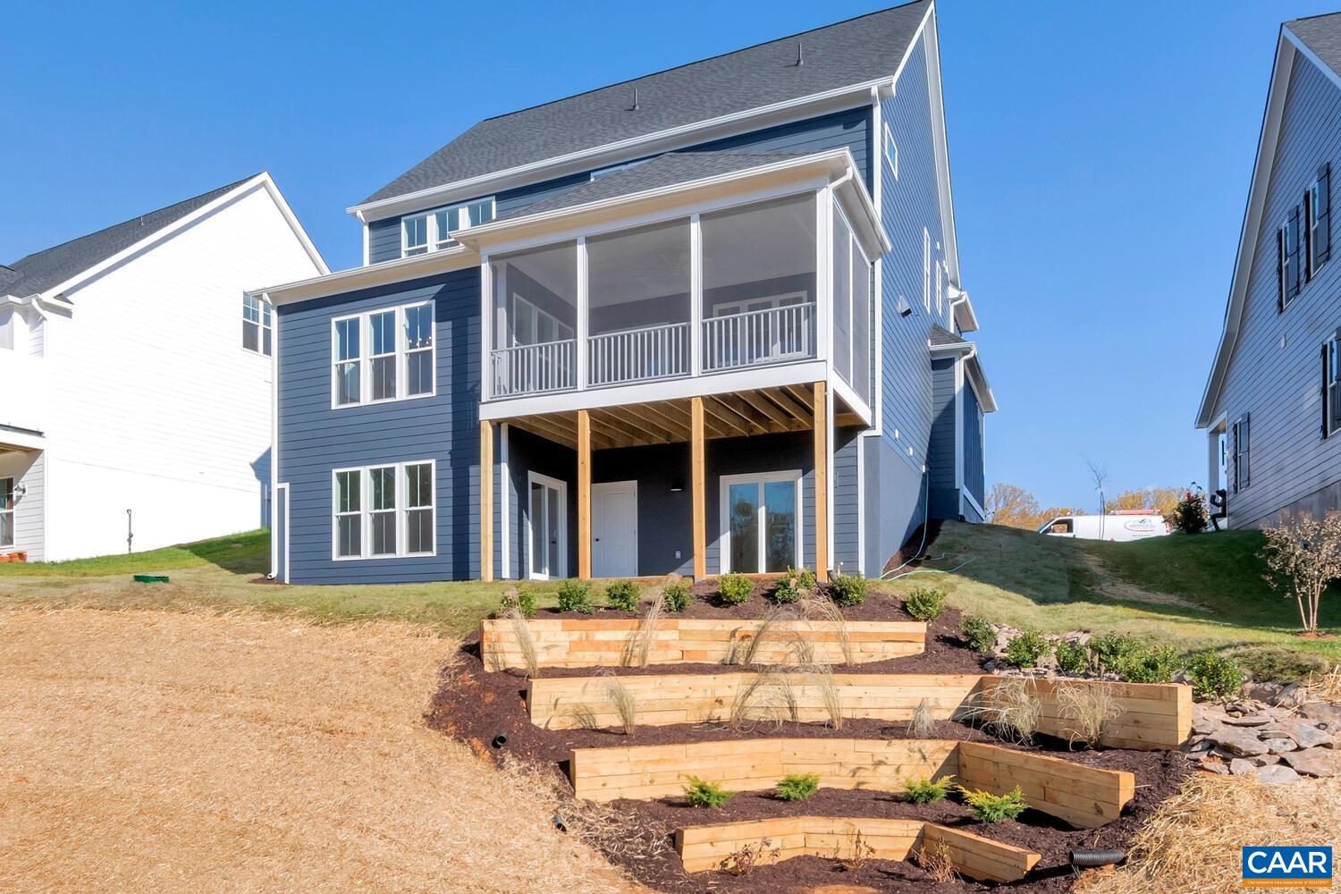 115226 Riparian Court Charlottesville, VA 22911 - Photo 43 of 49 a front view of a house with a yard