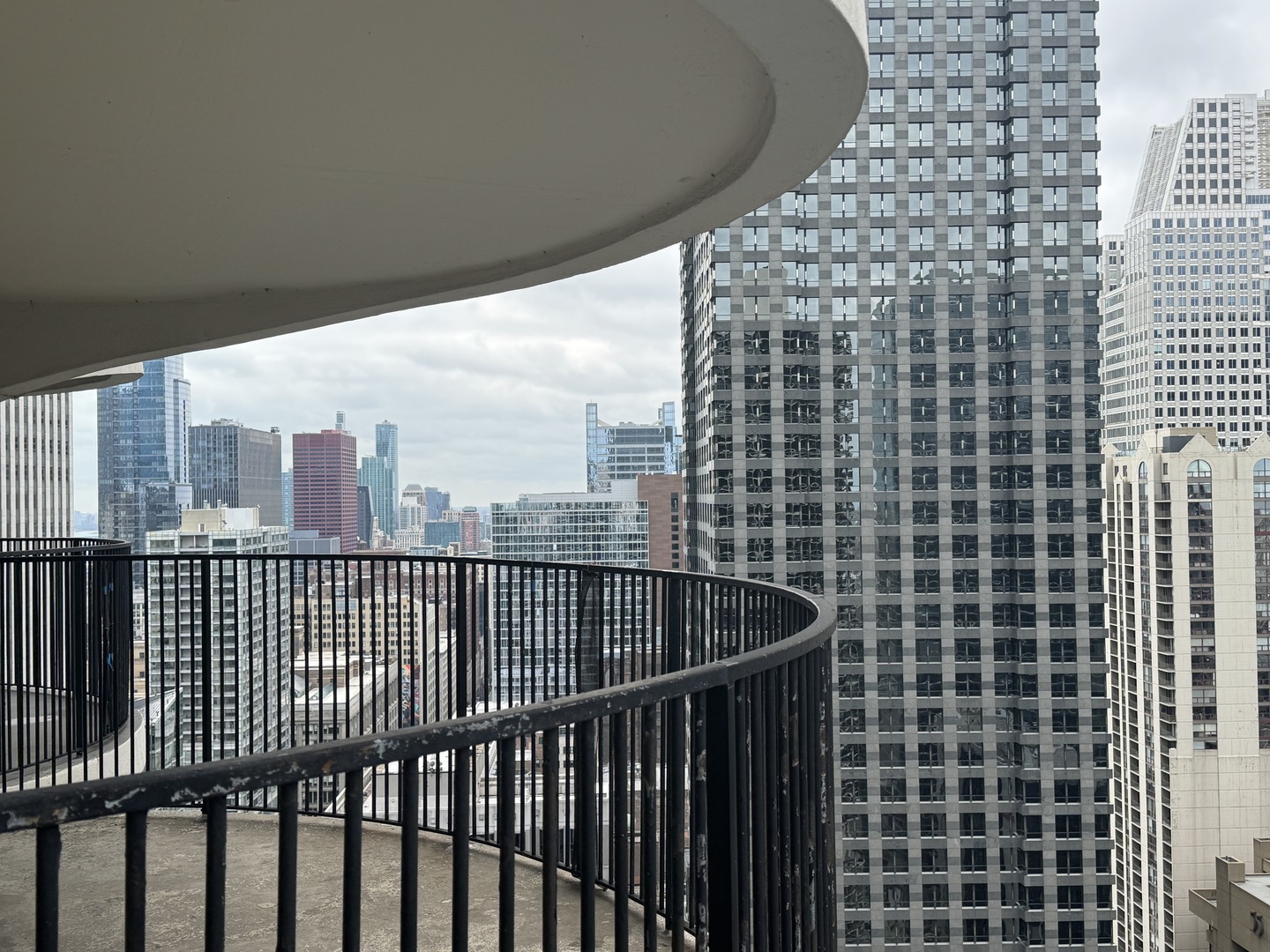 300 North State Street, Unit 4725 Chicago, IL 60654 - Photo 13 of 19 a view of a balcony with a floor to ceiling window