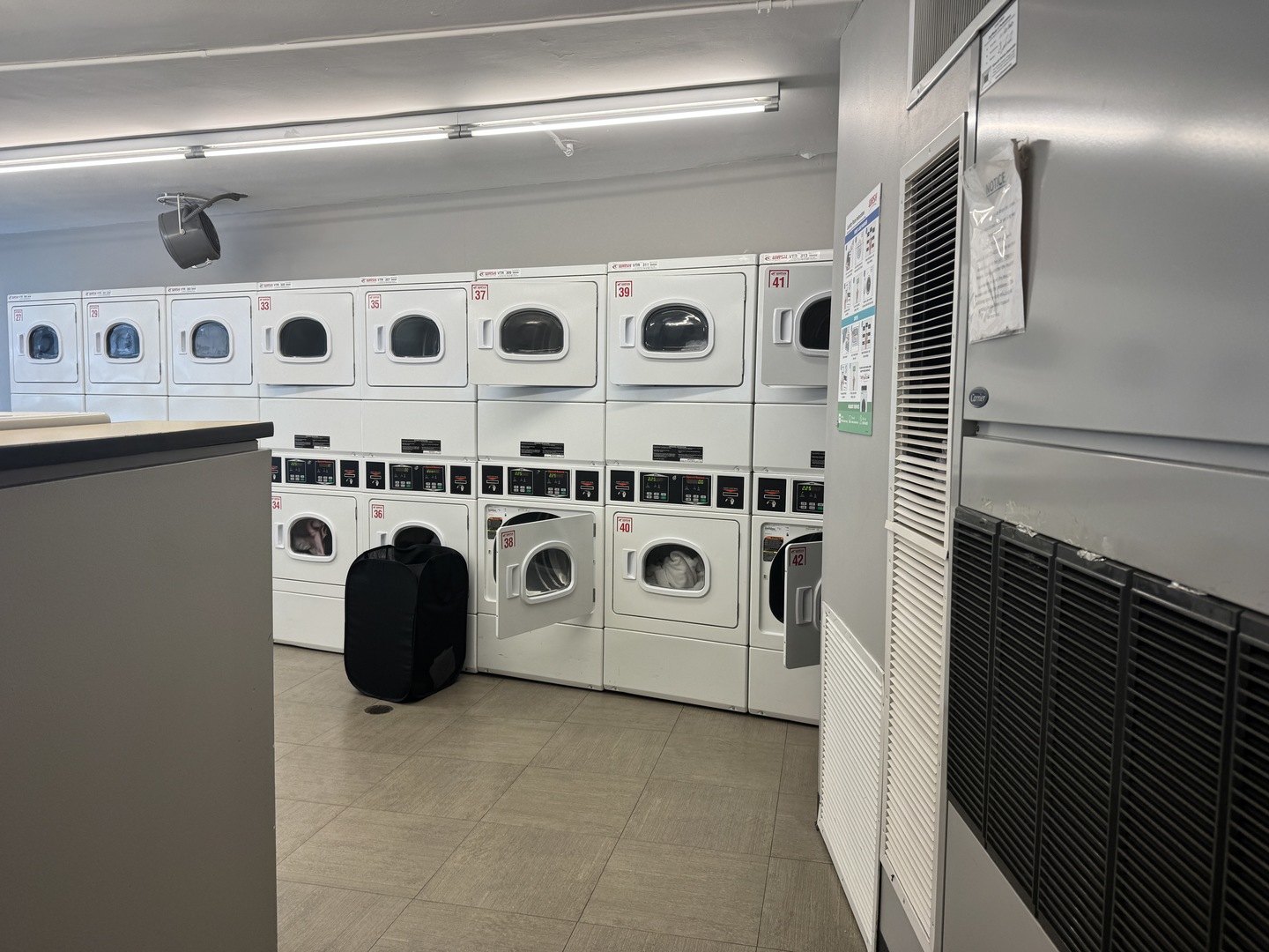 300 North State Street, Unit 4725 Chicago, IL 60654 - Photo 16 of 19 a utility room with dryer and washer