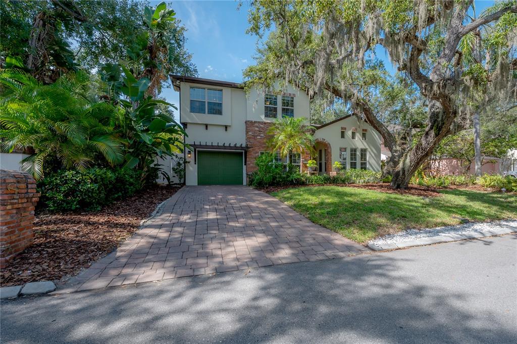 3108 West Villa Rosa Street Tampa, FL 33611 - Photo 57 of 58 a front view of a house with a yard and garage