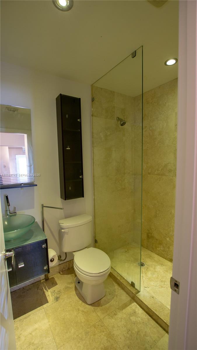 577 Northeast 62nd Street, Unit 2 Miami, FL 33138 - Photo 12 of 21 a bathroom with a toilet and a shower