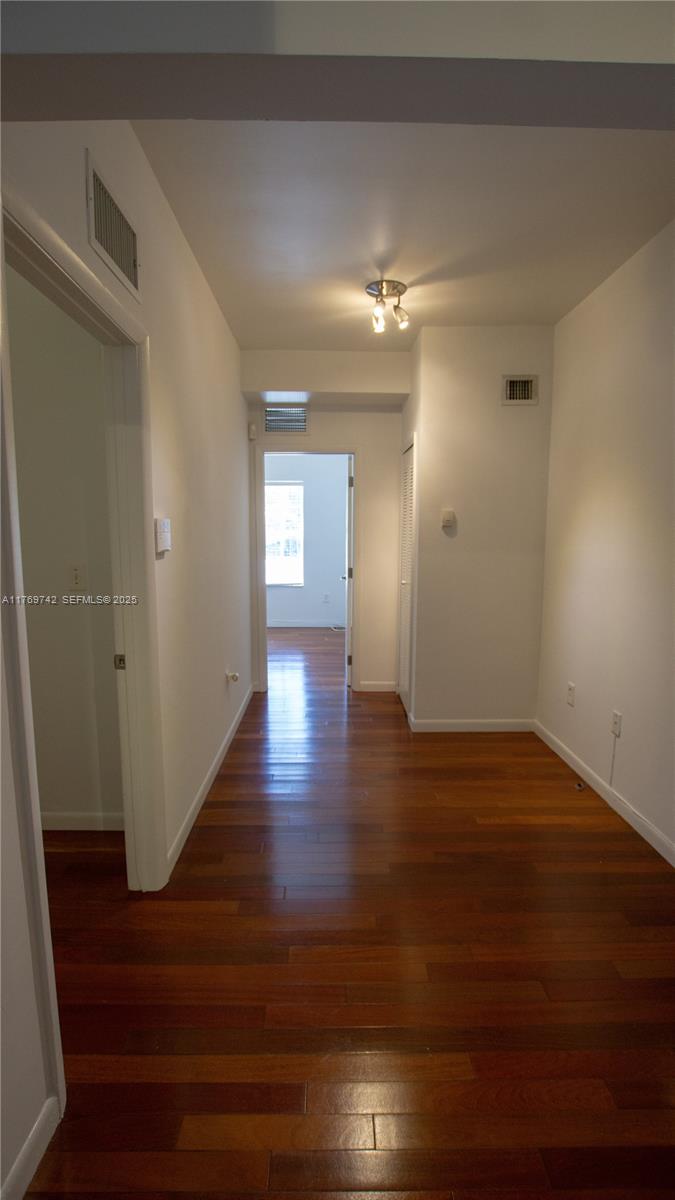 577 Northeast 62nd Street, Unit 2 Miami, FL 33138 - Photo 14 of 21 a view of empty room with wooden floor