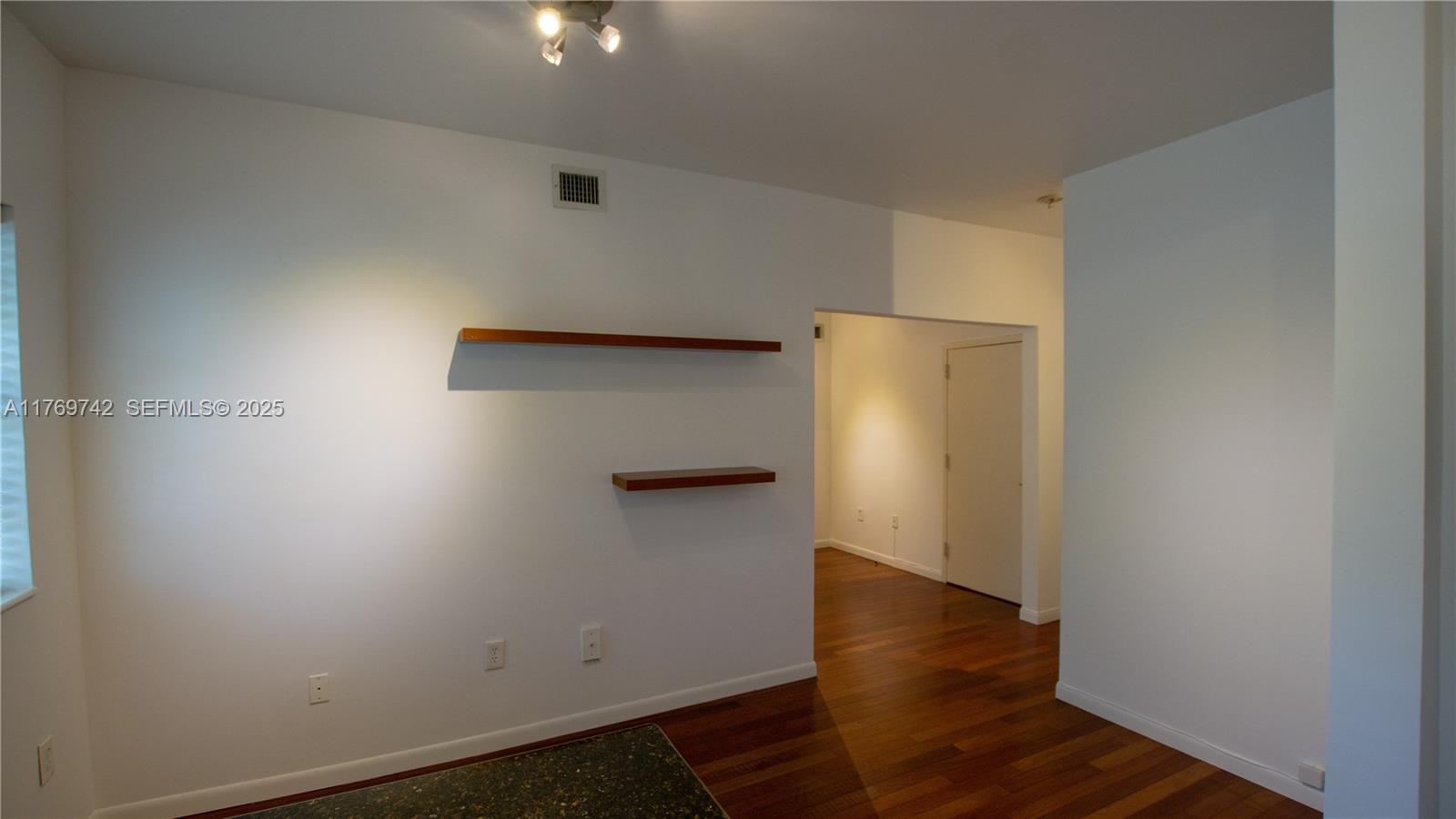 577 Northeast 62nd Street, Unit 2 Miami, FL 33138 - Photo 16 of 21 an empty room with wooden floor
