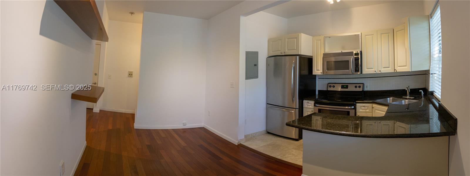 577 Northeast 62nd Street, Unit 2 Miami, FL 33138 - Photo 19 of 21 a kitchen with a sink appliances and cabinets
