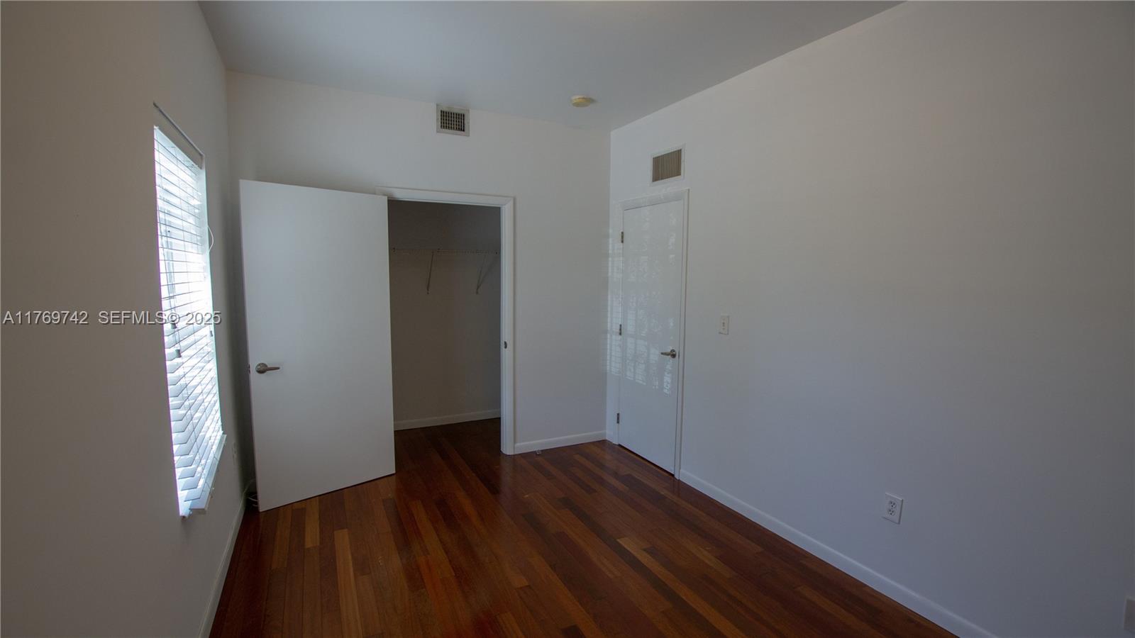 577 Northeast 62nd Street, Unit 2 Miami, FL 33138 - Photo 5 of 21 a view of hallway with wooden floor