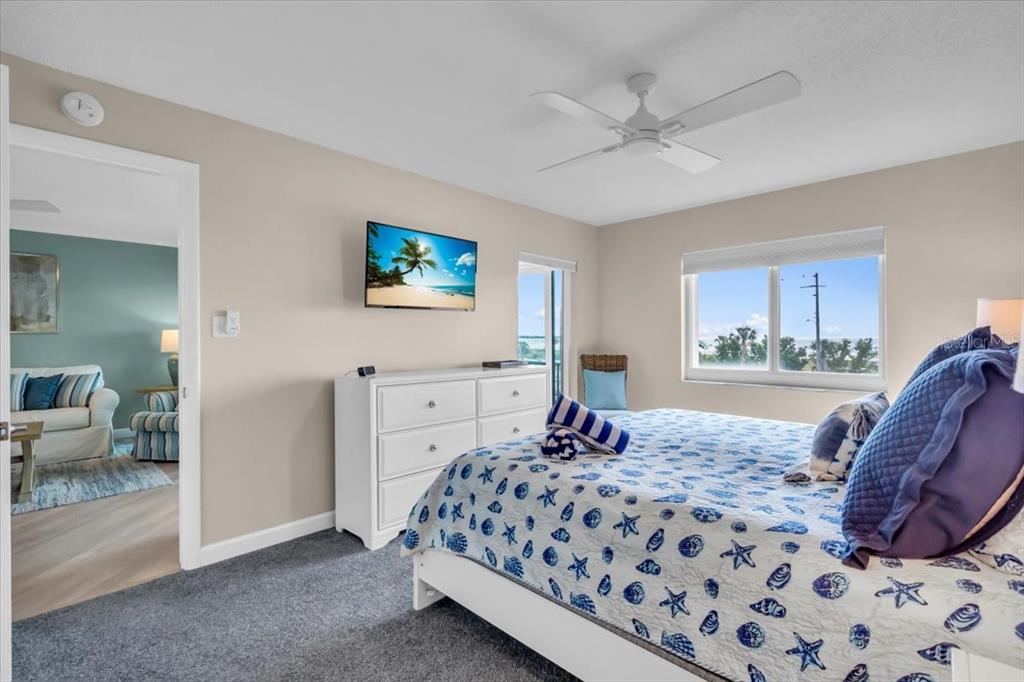 757 Beach Road, Unit 310 Sarasota, FL 34242 - Photo 12 of 31 a bedroom with a large bed and a window