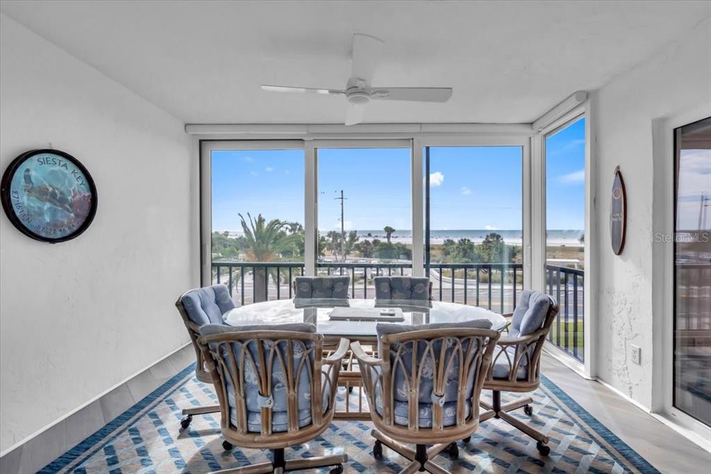 757 Beach Road, Unit 310 Sarasota, FL 34242 - Photo 19 of 31 a view of a dining room with furniture window and outside view