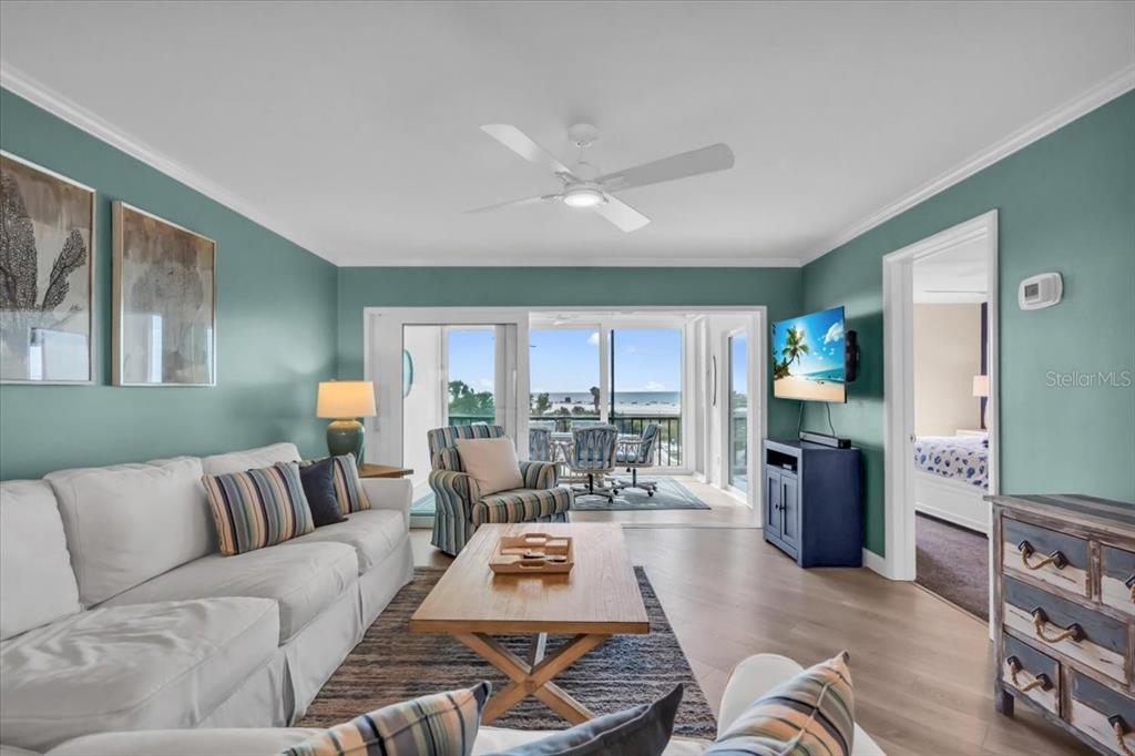 757 Beach Road, Unit 310 Sarasota, FL 34242 - Photo 2 of 31 a living room with furniture and a large window