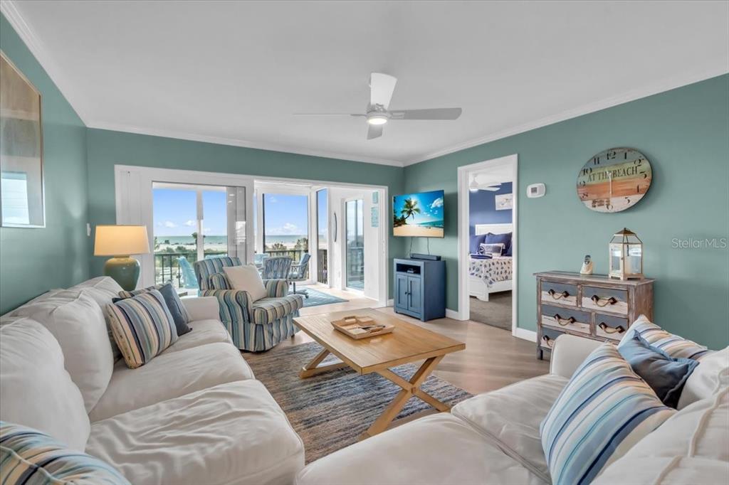 757 Beach Road, Unit 310 Sarasota, FL 34242 - Photo 3 of 31 a living room with furniture fireplace and a window