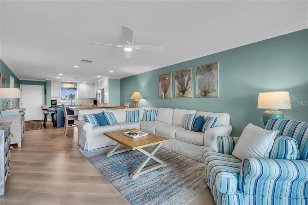757 Beach Road, Unit 310 Sarasota, FL 34242 - Photo 5 of 31 a living room with furniture and view of kitchen