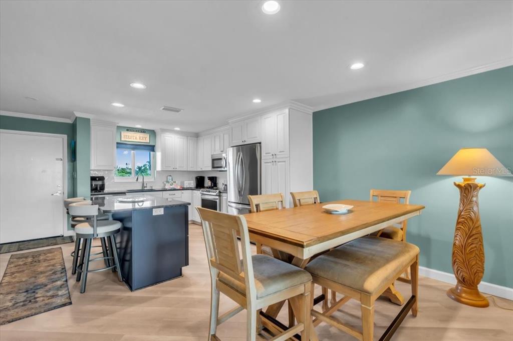757 Beach Road, Unit 310 Sarasota, FL 34242 - Photo 6 of 31 a view of a dining room with furniture