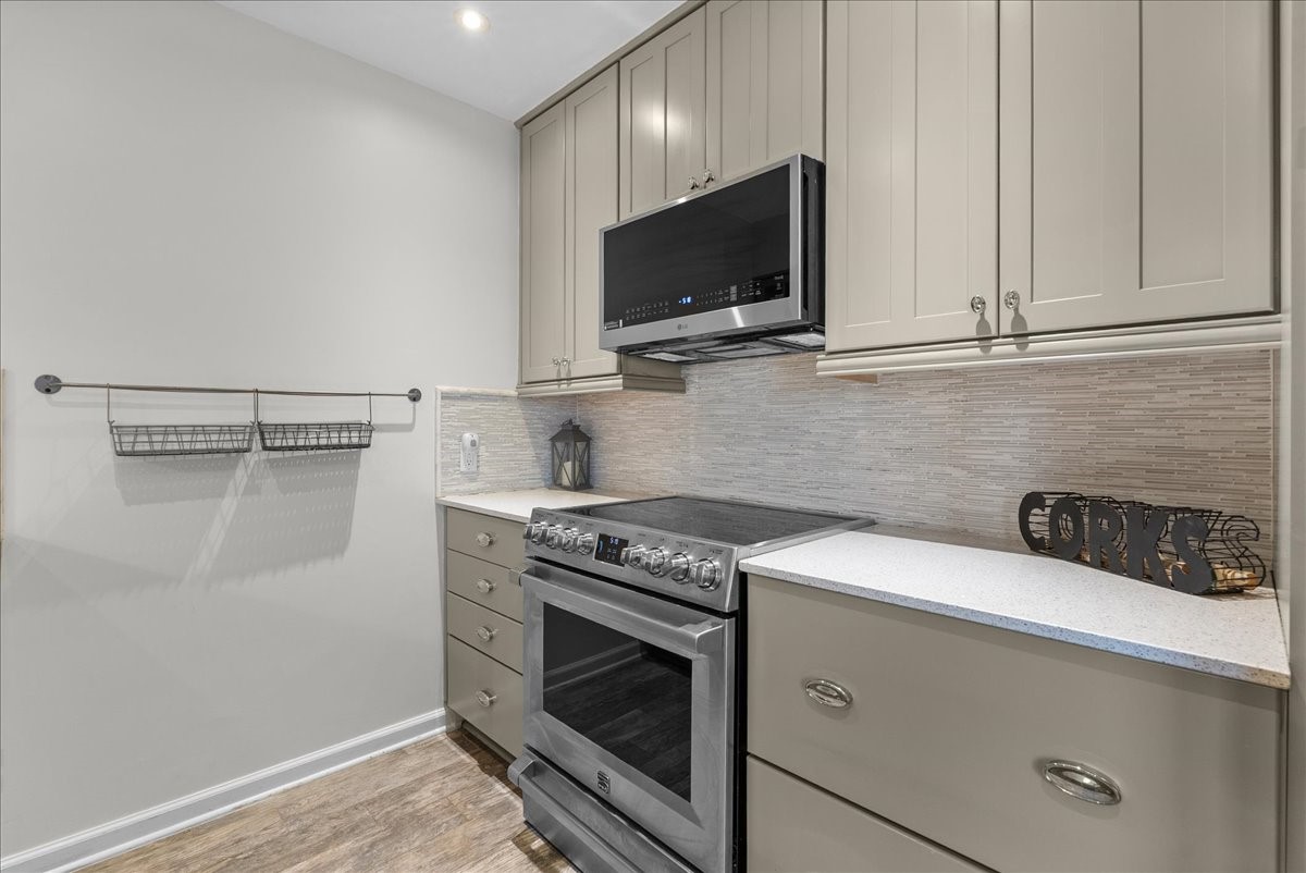 1572 Silverpines Road, Unit 572 Houston, TX 77062 - Photo 11 of 37 The beautiful backsplash, ample drawer space, and updated appliances pack a punch in this kitchen space--perfect for meal prepping and cooking!