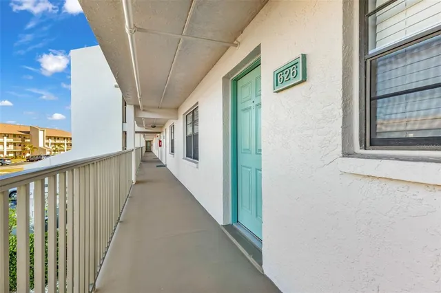 a view of a hallway with windows