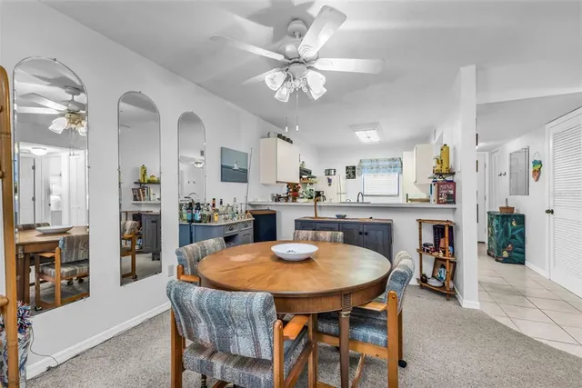 a kitchen with a table and chairs in it