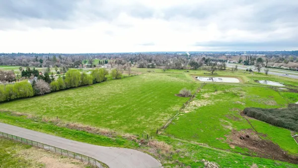 a view of a lake with a big yard