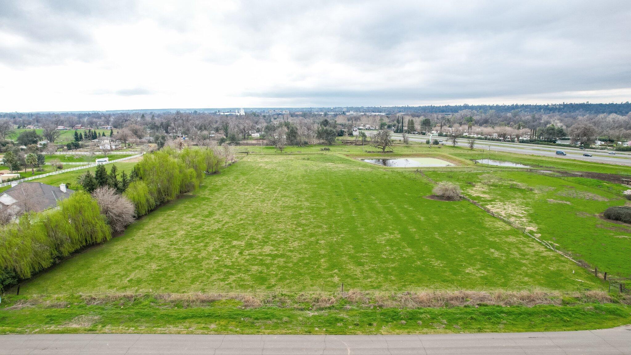 Milky Way Redding, CA 96002 - Photo 12 of 16 an aerial view of residential houses with outdoor space and trees