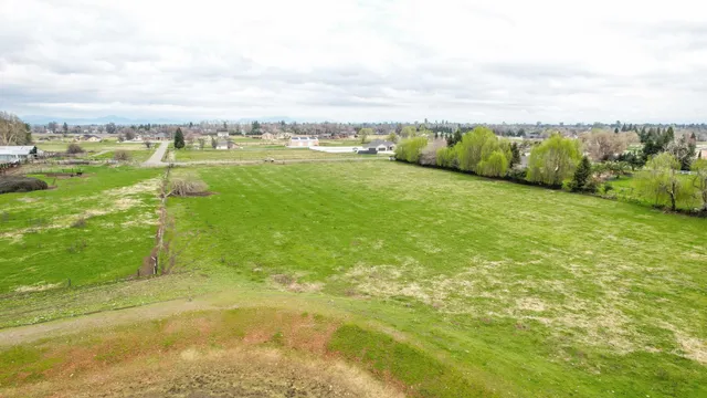 a view of a lake with houses in the back