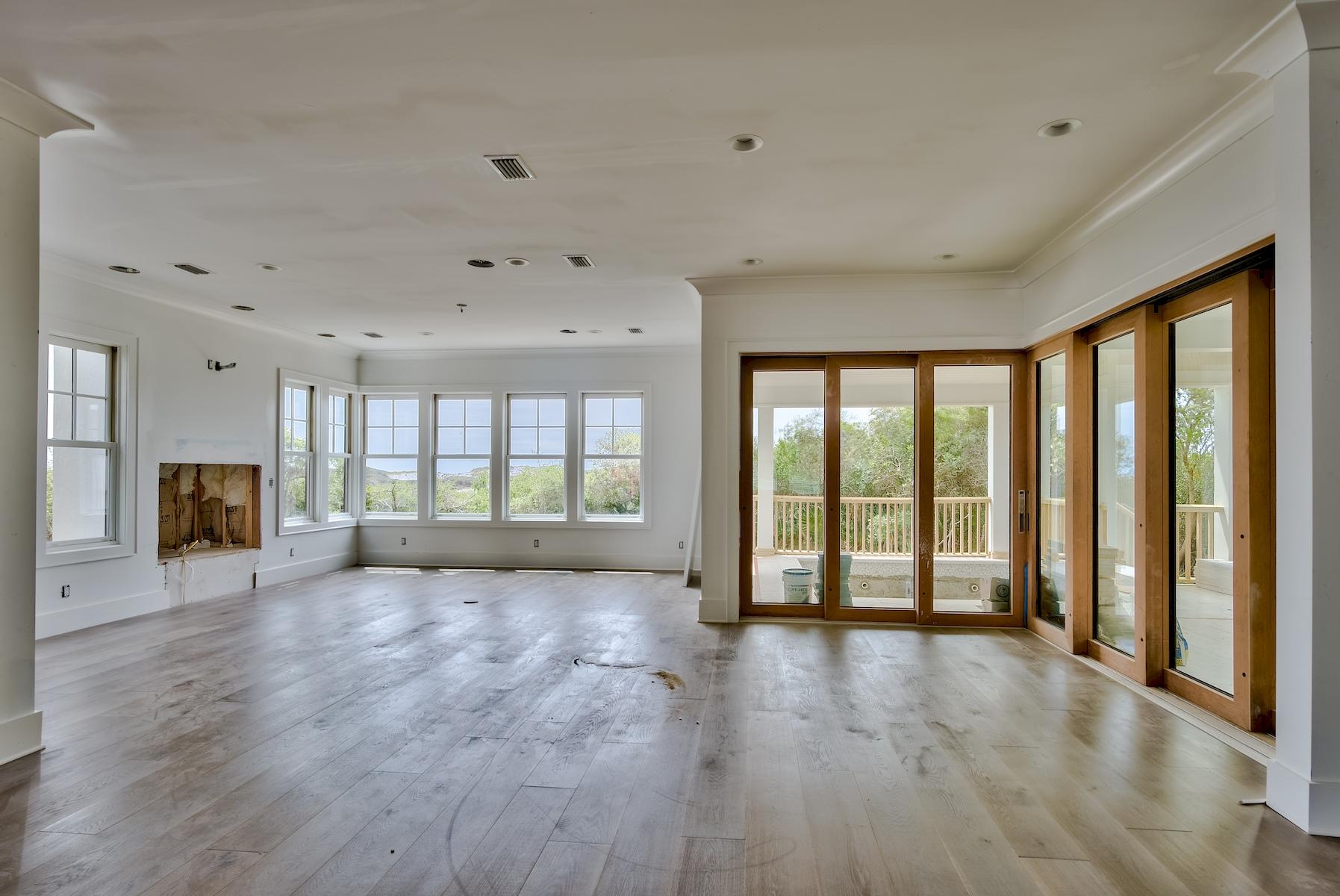 86 Tidal Bridge Way Inlet Beach, FL 32461 - Photo 13 of 32 a view of an empty room with wooden floor and a window