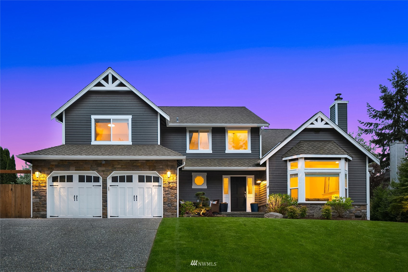 3228 211th Street Southeast Bothell, WA 98021 - Photo 1 of 40 a front view of a house with a yard