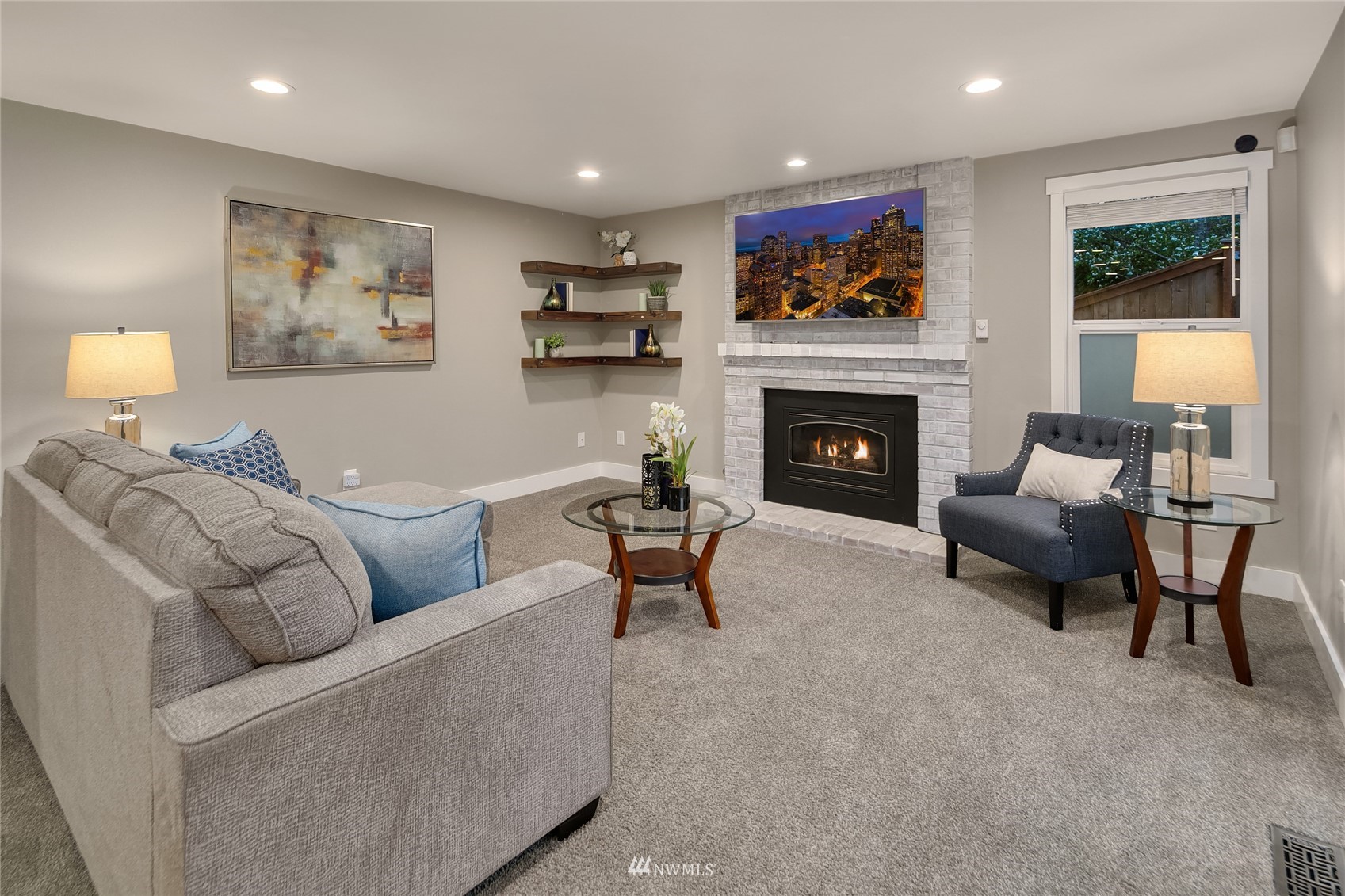 3228 211th Street Southeast Bothell, WA 98021 - Photo 13 of 40 a living room with furniture and a fireplace