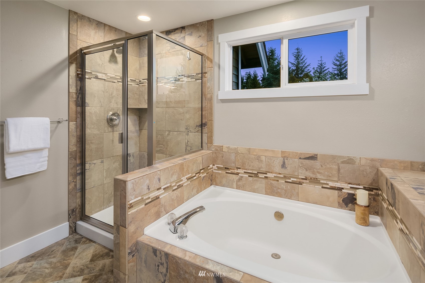3228 211th Street Southeast Bothell, WA 98021 - Photo 20 of 40 a bathroom with a bathtub and a shower