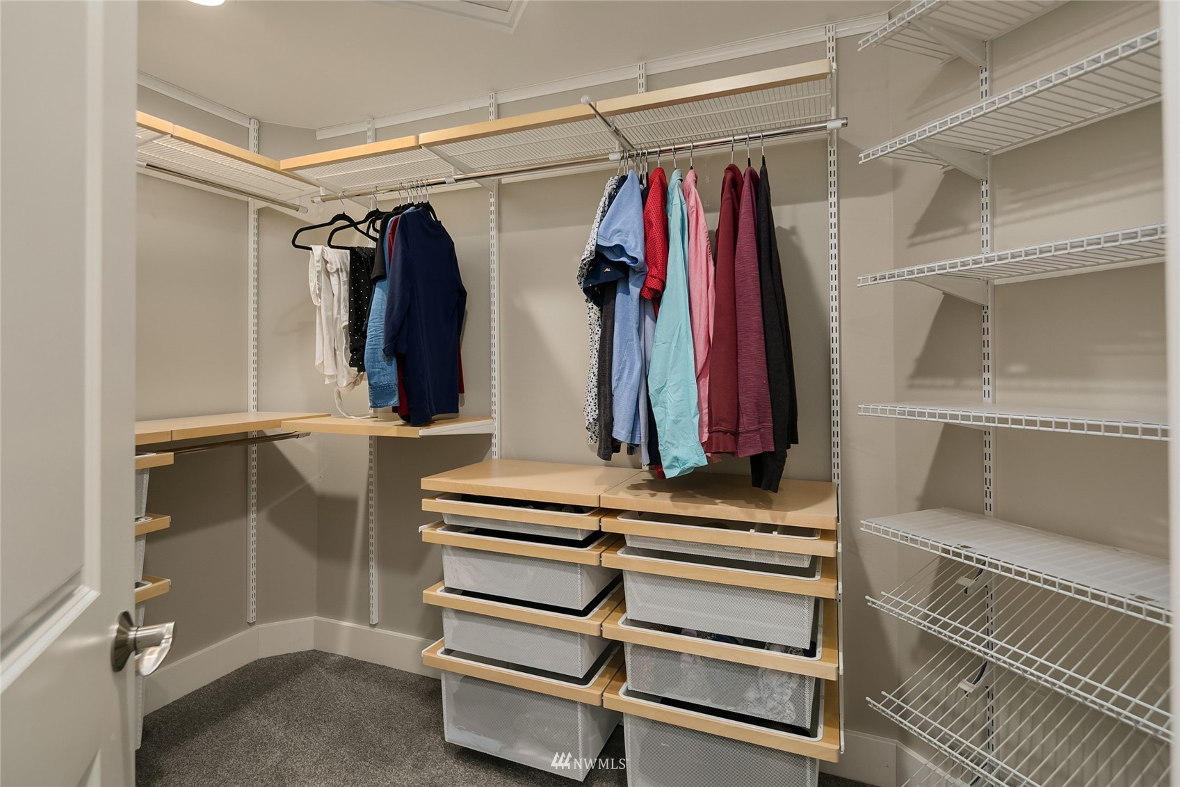 3228 211th Street Southeast Bothell, WA 98021 - Photo 21 of 40 a view of walk in closet with clothes and shoes