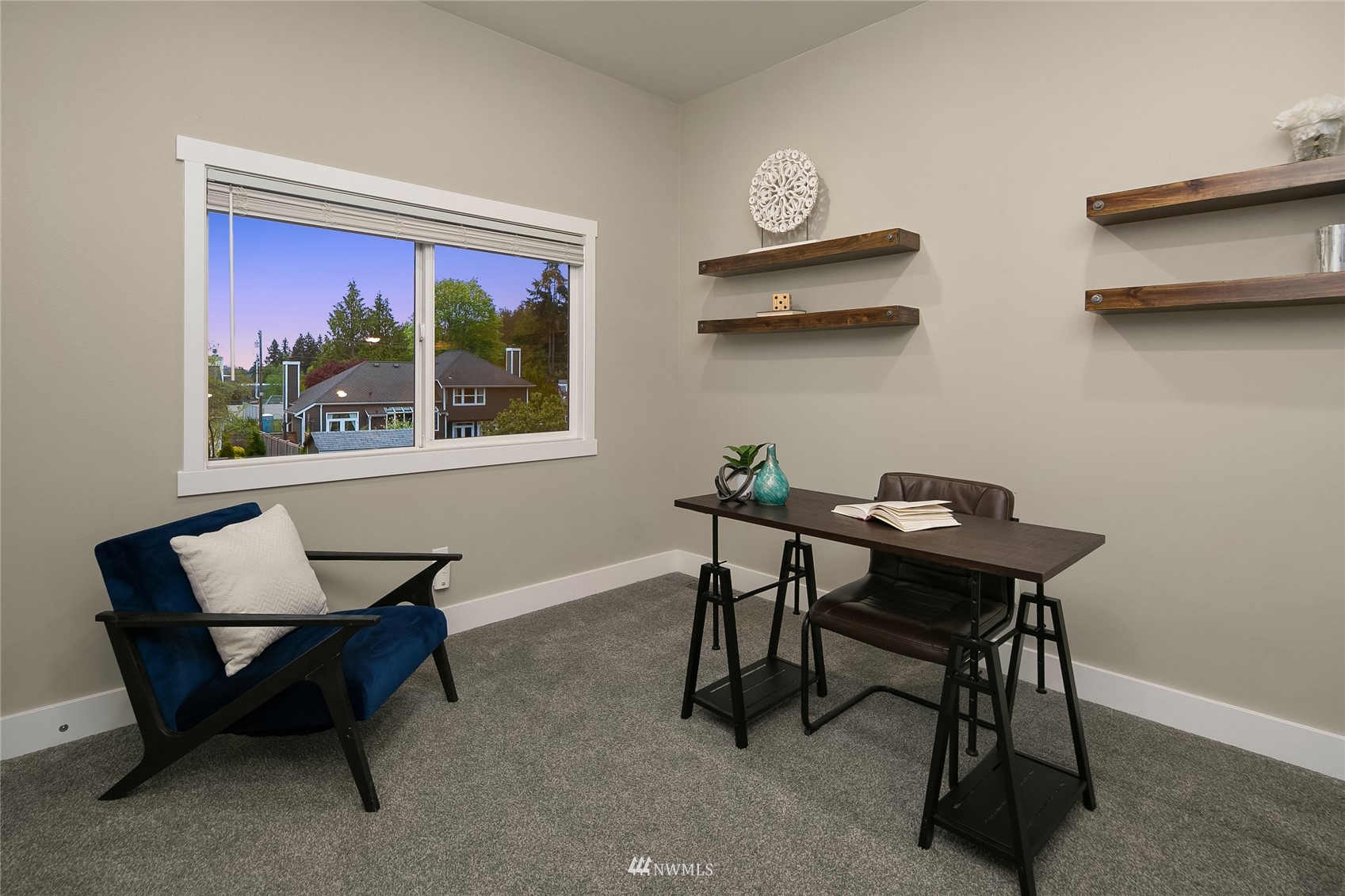 3228 211th Street Southeast Bothell, WA 98021 - Photo 24 of 40 a view of a workspace with furniture and a window