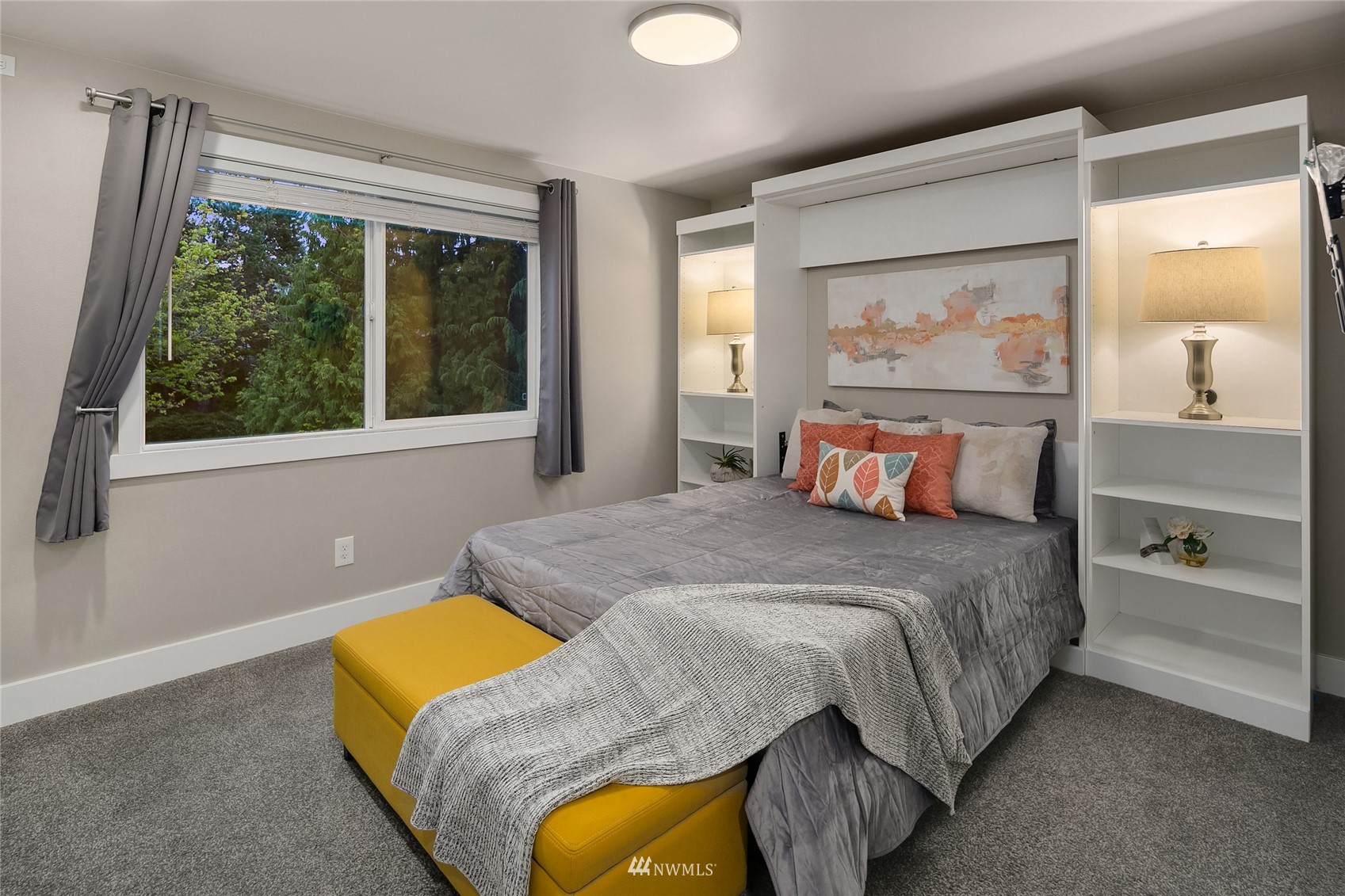 3228 211th Street Southeast Bothell, WA 98021 - Photo 27 of 40 a bedroom with a bed and painting on the wall