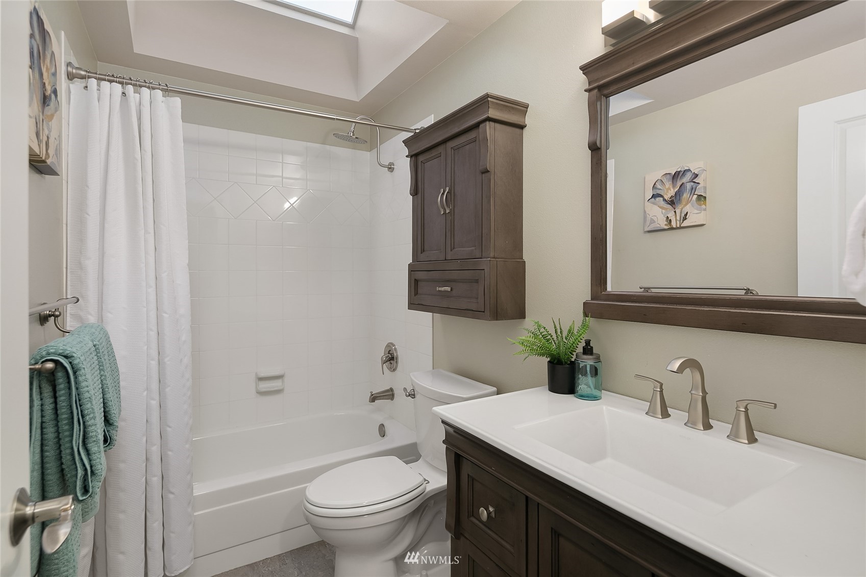 3228 211th Street Southeast Bothell, WA 98021 - Photo 28 of 40 a bathroom with a sink a toilet and shower