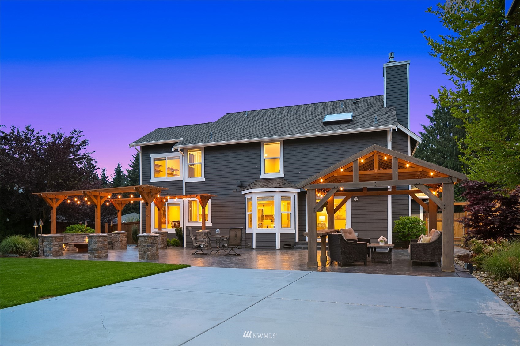 3228 211th Street Southeast Bothell, WA 98021 - Photo 30 of 40 a view of a house with swimming pool and sitting area