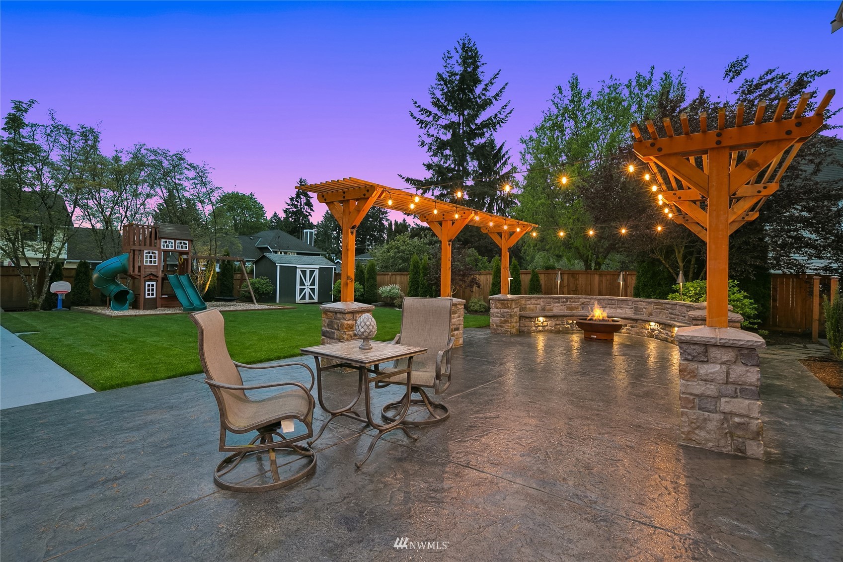 3228 211th Street Southeast Bothell, WA 98021 - Photo 33 of 40 a view of a swimming pool with a table and chairs