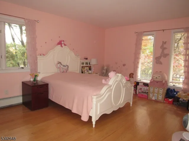 a bathroom with a tub a sink a mirror and a shower