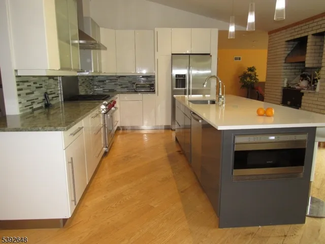a view of a livingroom with furniture and fireplace