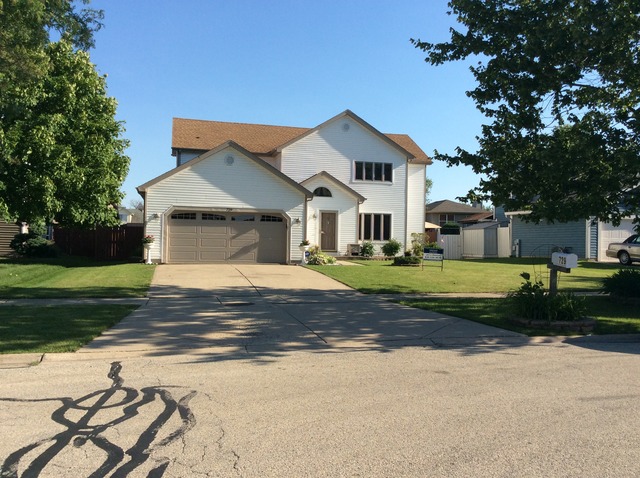 729 Rockhurst Road Bolingbrook, IL 60440 - Photo 1 of 20 a front view of a house with a yard