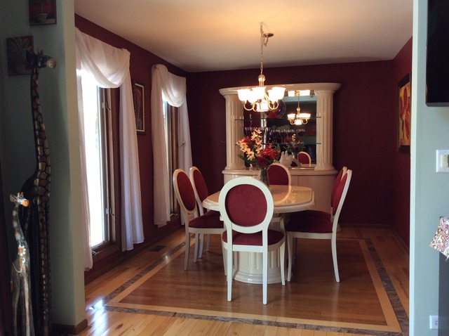 729 Rockhurst Road Bolingbrook, IL 60440 - Photo 4 of 20 a dining room with furniture a chandelier and window