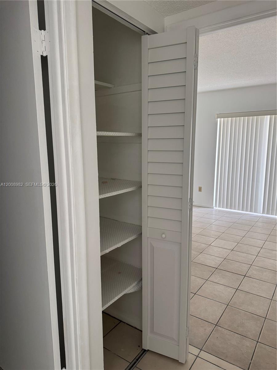 7747 Southwest 86th Street, Unit D105 Miami, FL 33143 - Photo 11 of 14 a view of a hallway