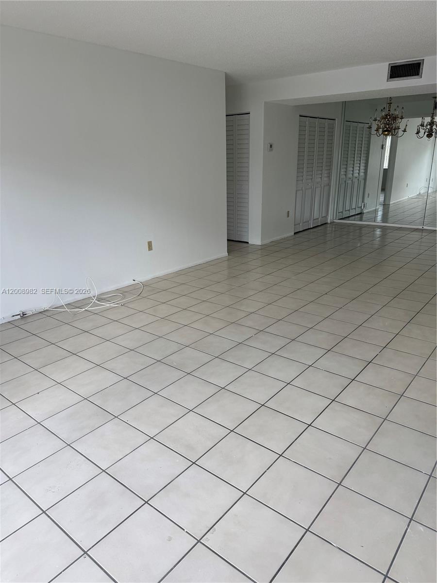 7747 Southwest 86th Street, Unit D105 Miami, FL 33143 - Photo 4 of 14 a view of an empty room