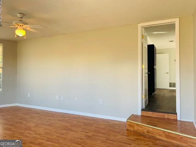 a view of a livingroom with wooden floor