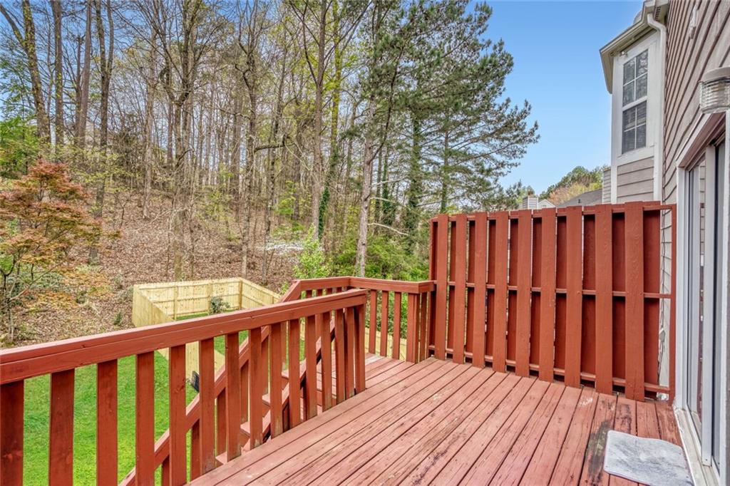 4120 Spring Cove Drive Duluth, GA 30097 - Photo 15 of 24 a balcony with wooden floor and fence