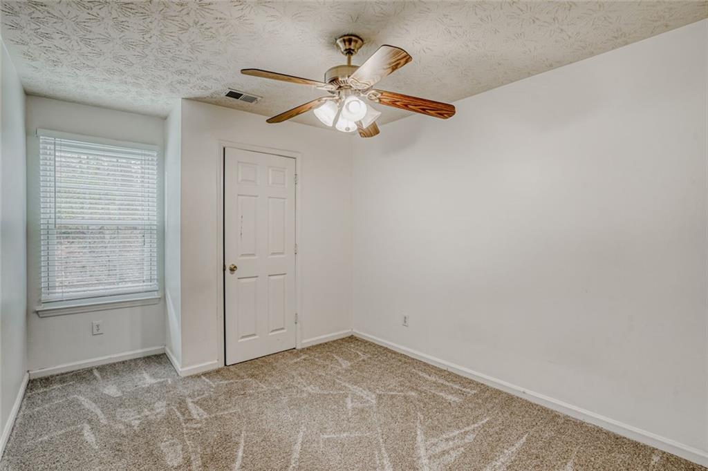 4120 Spring Cove Drive Duluth, GA 30097 - Photo 17 of 24 a view of an empty room with a window