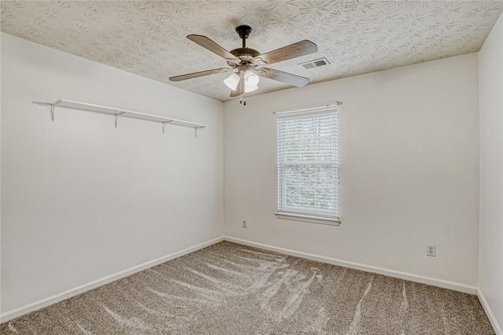 4120 Spring Cove Drive Duluth, GA 30097 - Photo 18 of 24 a view of an empty room with a window
