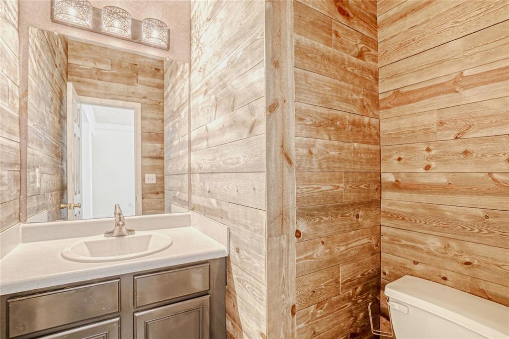 4120 Spring Cove Drive Duluth, GA 30097 - Photo 21 of 24 a bathroom with a sink and a mirror