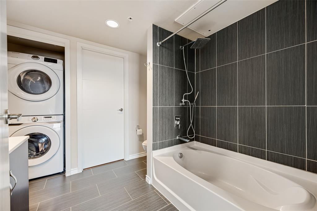 1100 West Trinity Mills Road, Unit 2040 Carrollton, TX 75006 - Photo 12 of 21 a bathroom with a bathtub and a shower