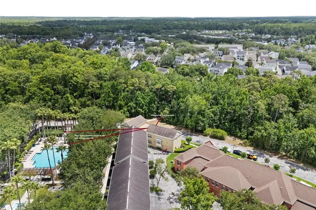 a bedroom with furniture and large window