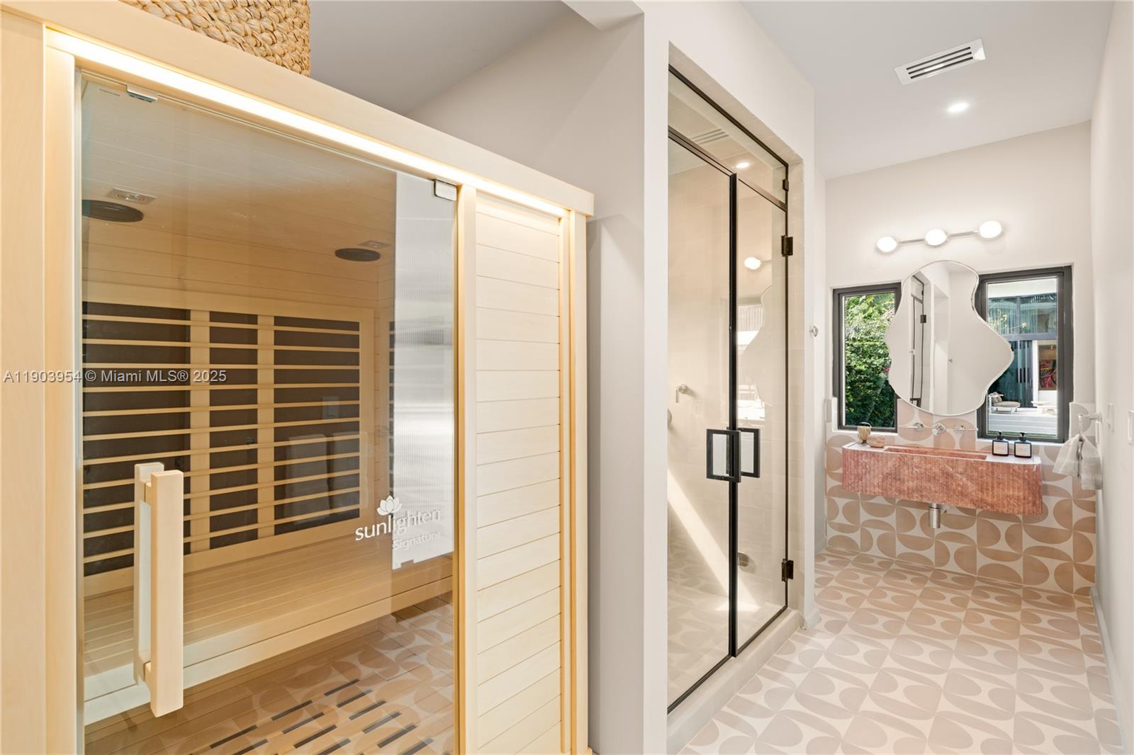 2053 North Bay Road Miami Beach, FL 33140 - Photo 17 of 99 a view of a hallway with wooden floor and a bathroom