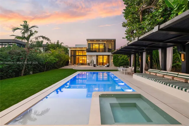 a view of swimming pool with a lounge chairs