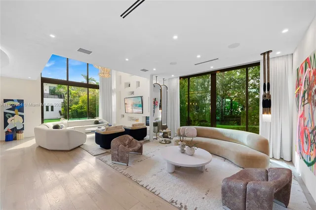 a bathroom with a sink and mirror with toilet