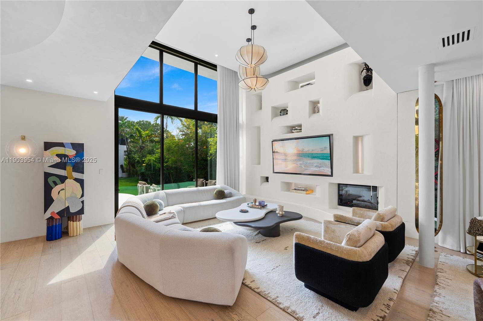 2053 North Bay Road Miami Beach, FL 33140 - Photo 30 of 99 a living room with furniture and a large window