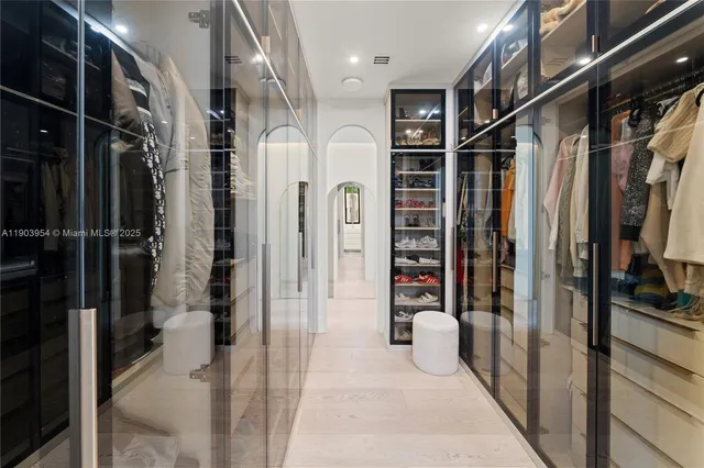 a view of a patio with table and chairs potted plants with wooden floor and fence