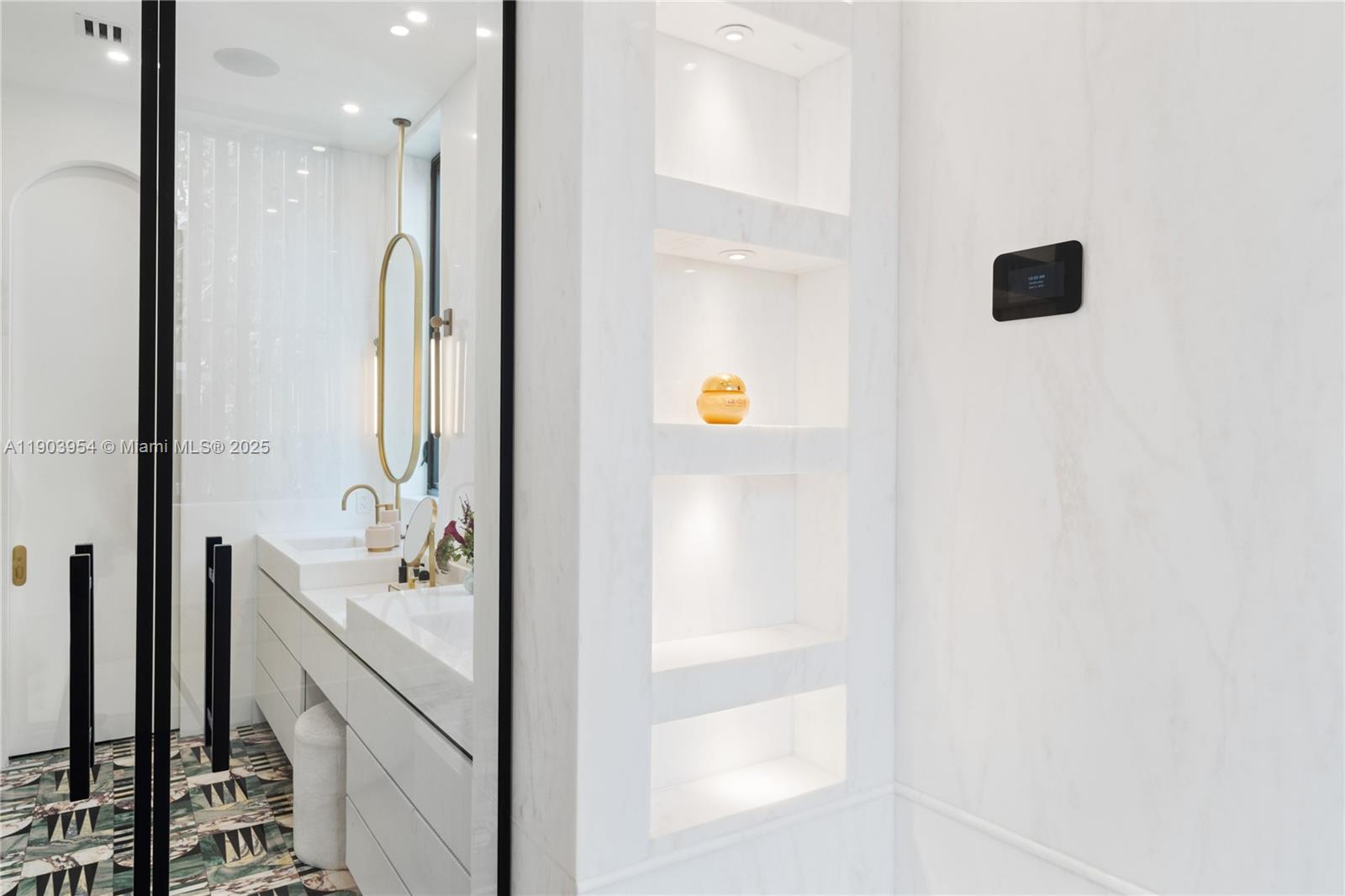 2053 North Bay Road Miami Beach, FL 33140 - Photo 50 of 99 a bathroom with a sink a tub and a mirror